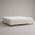 Boxspringbett 180 x 200 cm mit Taschenfederkernmatratze und Topper, Polyesterbezug Creme, Holzfüße Naturbraun, ohne Kopfteil
